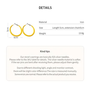 Vibrant yellow enamel hoop earrings featuring a 5cm diameter and 925 silver needle details