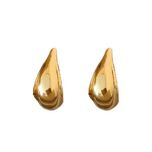 Minimalist gold water drop stud earrings with silver needles for stylish daily wear.