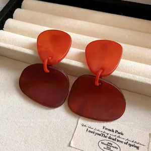 Vintage irregular marbled geometric drop earrings featuring warm amber and red tones