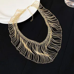 Elegant gold snake chain fringe statement necklace with wavy tassel design details