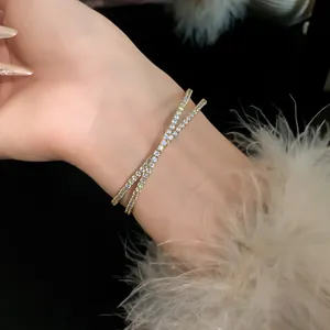 Elegant double-layer criss-cross zircon open bangle bracelet shown on model wrist detail