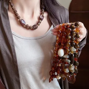 Retro Maillard style marbled beaded necklace with irregular resin pendants and gold beads