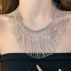 Detail of silver snake chain fringe necklace with dramatic metallic tassel design
