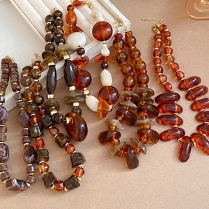 Vintage Maillard style necklaces with irregular amber resin beads and elegant aesthetic design