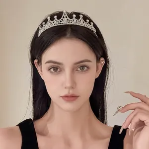 Elegant silver rhinestone flower crown headband for birthday party and wedding fashion styling.