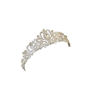 Elegant silver rhinestone tiara with flower and teardrop design for birthday parties.