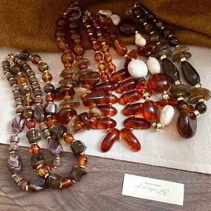 Detailed view of vintage Maillard style necklaces with irregular marbled resin beads