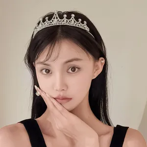 Elegant rhinestone flower teardrop tiara headband worn by model for party