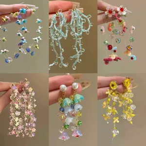 Dramatic colorful floral tassel drop earrings with pearls and beads for a bold artistic style