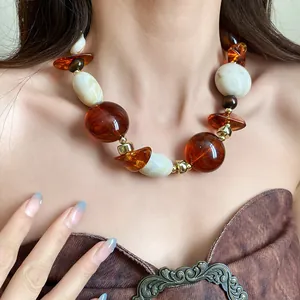Vintage Maillard style chunky necklace with irregular amber and marbled resin beads detail