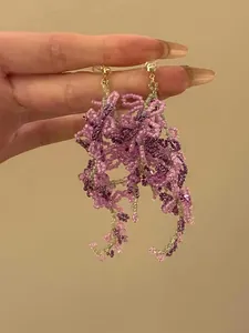 Elegant handcrafted purple floral beaded tassel earrings with delicate silver needles