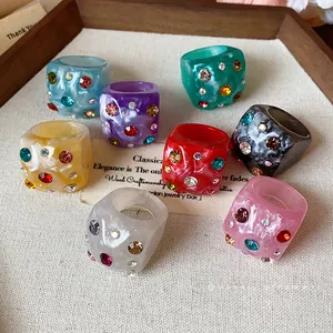 Colorful dopamine style resin rings with wrinkled texture and vibrant rhinestones