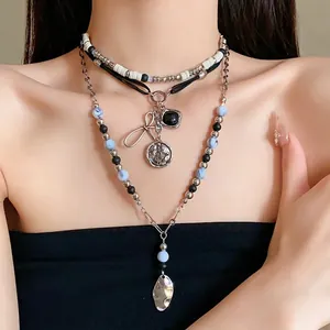 Vintage ethnic style multi-layer beaded necklace with bow and coin pendants for women