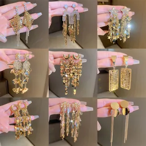 Collection of elegant gold-toned long tassel earrings with sparkling sequins and rhinestones