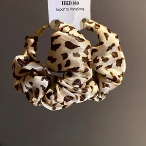 Retro leopard print fabric wrapped hoop earrings with silver needle hooks