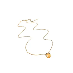 Elegant gold circular pendant necklace featuring a minimalist slim chain design