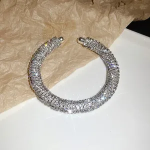 Macro view showing the sparkling rhinestone detail on the threaded silver cuff bracelet