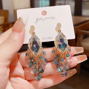 Detailed shot of vintage blue teardrop crystal tassel earrings with S925 silver needles design.