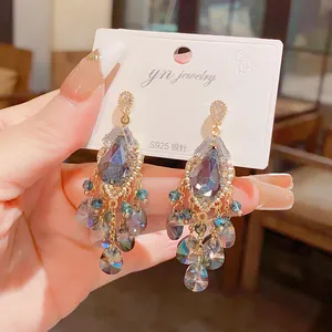 Detailed view of vintage glass teardrop tassel earrings with an S925 silver needle post