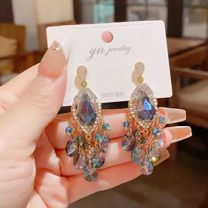 Close-up of retro teardrop crystal tassel earrings featuring S925 silver needles and blue glass