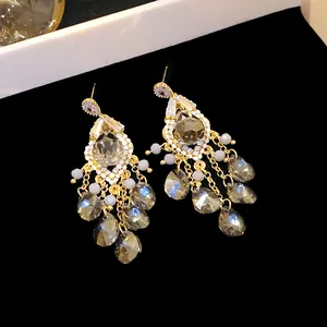 Elegant silver needle tassel earrings featuring sparkly zircon and smoke gray glass beads.
