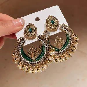 Exquisite vintage ethnic gold jhumka earrings with green enamel and pearl fringe