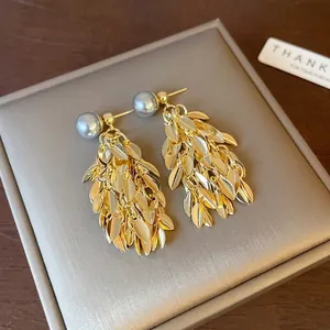 Elegant vintage gold leaf tassel earrings with grey artificial pearls for women.