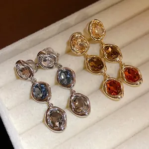 Vintage 18k gold plated earrings with oval gemstones and rhinestone accents
