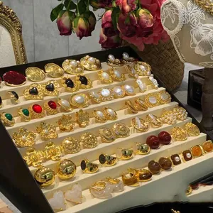 Large collection of vintage French style gold earrings with pearls and floral designs