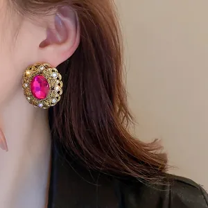 Vintage French style oval flower earrings with pink gemstone and golden metal details