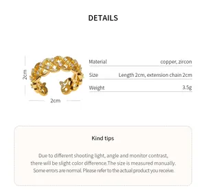 Macro detail view of an elegant 18k gold-plated hollow flower ring with zircon stones
