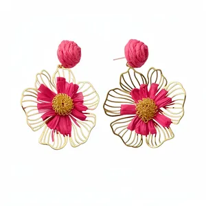 Handmade vibrant pink raffia flower drop earrings with elegant golden wireframe petals