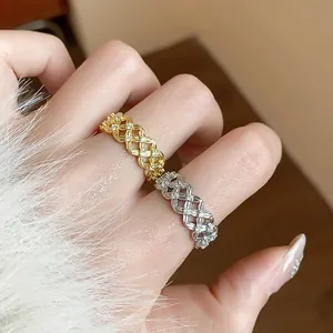Macro view of dainty 18k gold plated hollow lattice rings set with sparkling zircons