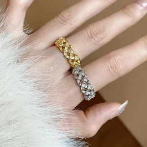 Close-up of elegant 18k gold and silver plated lattice rings with shimmering zircon