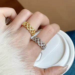 Close-up detail of luxury 18k gold plated hollow flower rings with sparkling zircon accents