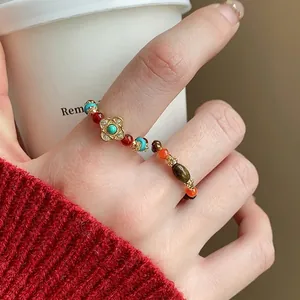 Anello elastico etnico vintage con perline in occhio di tigre e turchese dorato