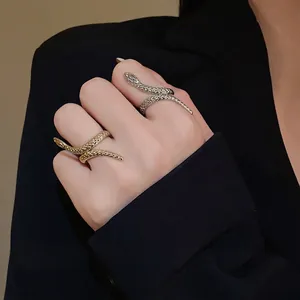 Unique twisted snake-shaped open ring set in gold and silver tones