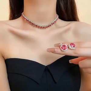 Elegant rhinestone jewelry set with red gemstone necklace and matching stud earrings