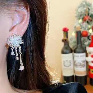 Detailed view of elegant 18k gold plated firework earrings with sparkling zircons