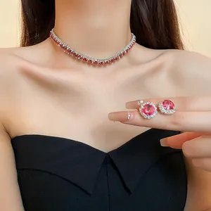 Elegant silver-tone jewelry set with red crystals, featuring a choker and matching earrings