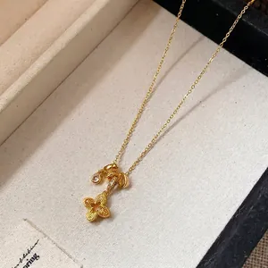 Vintage gold-plated flower pendant necklace with shimmering zircon accents for women