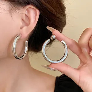 Minimalist silver-toned C-shaped chunky hoop earrings for women, stylish jewelry accessory