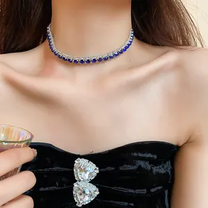 Detailed close-up of a sparkling blue crystal choker necklace worn by an elegant model