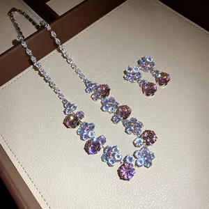Detailed view of elegant pink zircon flower necklace and stud earring jewelry set