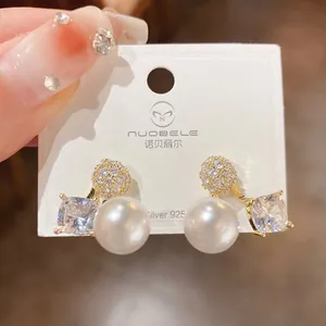 Exquisite gold-plated pearl and zircon stud earrings for an elegant fashion look.
