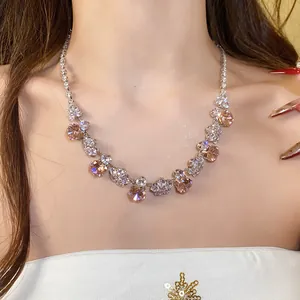 Detailed view of an elegant zircon flower necklace featuring peach and clear stones