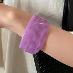 Detailed view of a purple marbled resin cuff bangle with a unique wrinkled texture