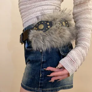 Bohemian wide leather belt with rivets and faux fur detail on denim skirt