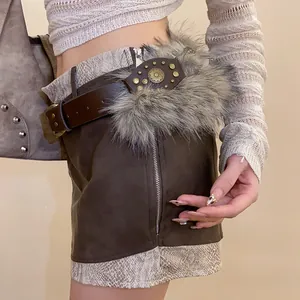 Detail of retro leather belt with faux fur trim, metal rivets and ornate oval buckle