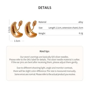 Vue détaillée des boucles d'oreilles clips gouttes dorées avec spécifications
